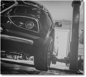 Car on a Hoist during repairs Car on a Hoist during repairs